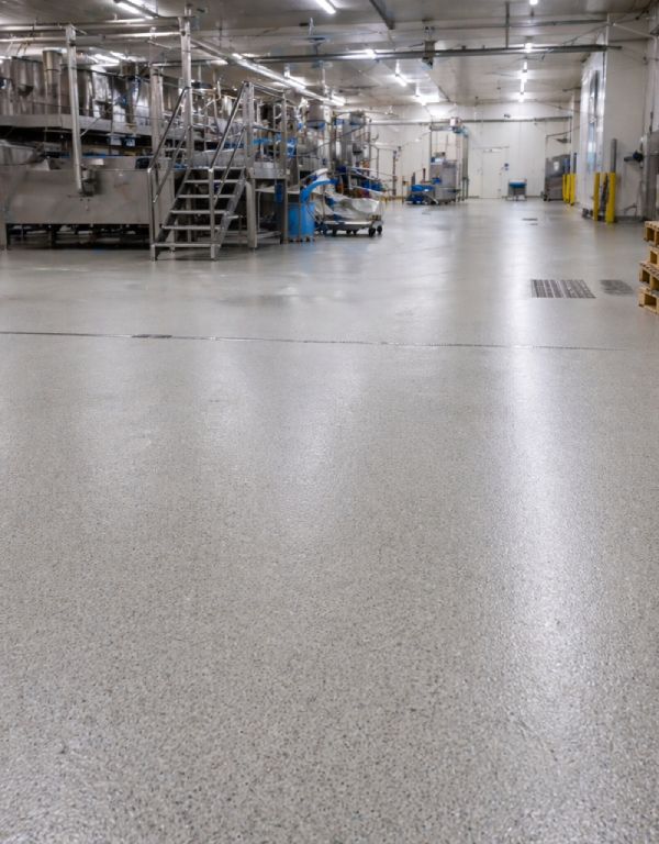 suelo con resinas epoxi sanitarias C3 y espolvoreado de arido en fabrica